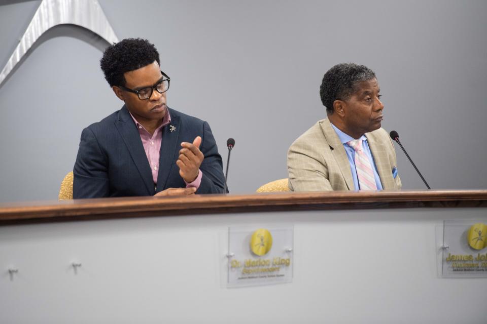 Superintendent Marlon King and District 1 member James Johnson listens in during public comments during a Jackson-Madison County School Board meeting in Jackson, Tennessee, on Tuesday, July 25, 2023.