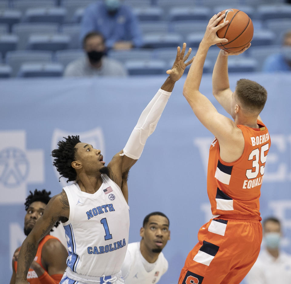 Syracuse's Buddy Boeheim (35) shoots over North Carolina's Leaky Black (1) during the first half of an NCAA college basketball game Tuesday, Jan. 12, 2021, in Chapel Hill, NC. (Robert Willett/The News & Observer via AP)