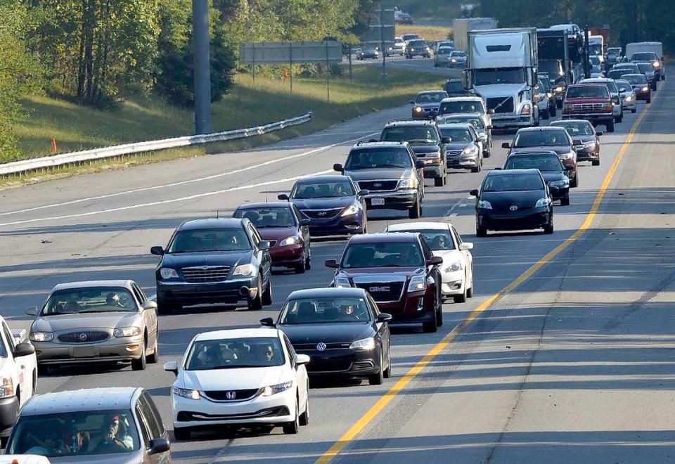 I-77 north bound traffic slowly advances at a crawl during the 5:00 PM commute on Oct. 02,2014, photo taken from the Gilead Road bridge at exit 23 in Huntersville.