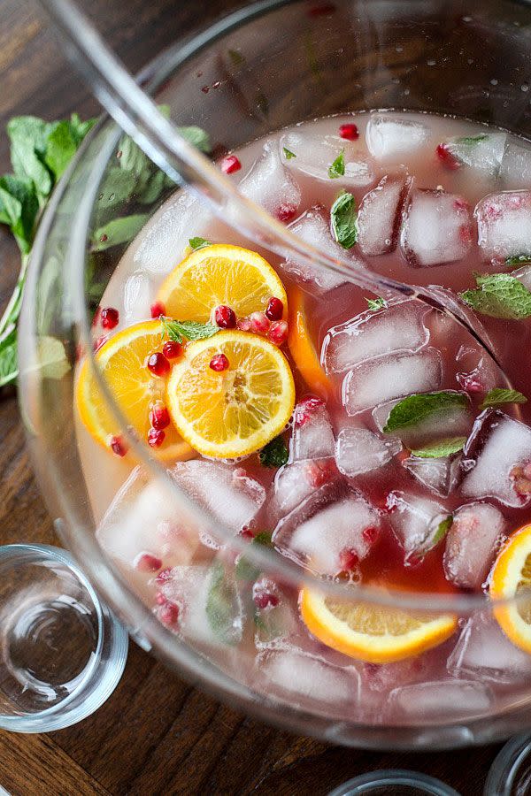 <p>Make this punch extra cheers-y by freezing ice cubes with pomegranate seeds and mint leaves inside. </p><p><em><a href="http://www.foodiecrush.com/pomegranate-and-orange-champagne-punch/" rel="nofollow noopener" target="_blank" data-ylk="slk:Get the recipe from Foodiecrush »;elm:context_link;itc:0;sec:content-canvas" class="link ">Get the recipe from Foodiecrush »</a></em></p>