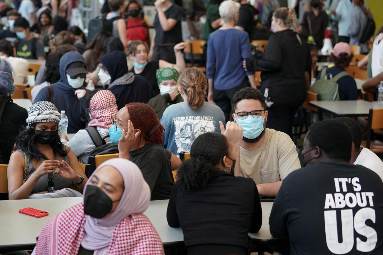 <span>Students gather in a dining hall at Emory as they protest in support of Palestinians.</span><span>Photograph: Elijah Nouvelage/Reuters</span>