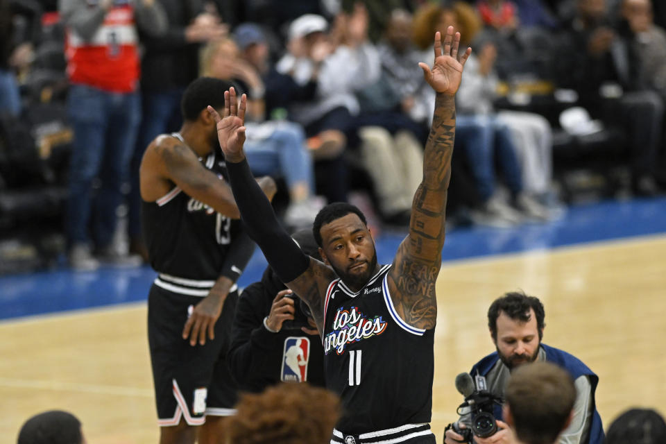 Los Angeles Clippers guard John Wall (11) acknowledges the crowd during the first quarter of the team's NBA basketball game against the Washington Wizards, Saturday, Dec. 10, 2022, in Washington. (AP Photo/Terrance Williams)