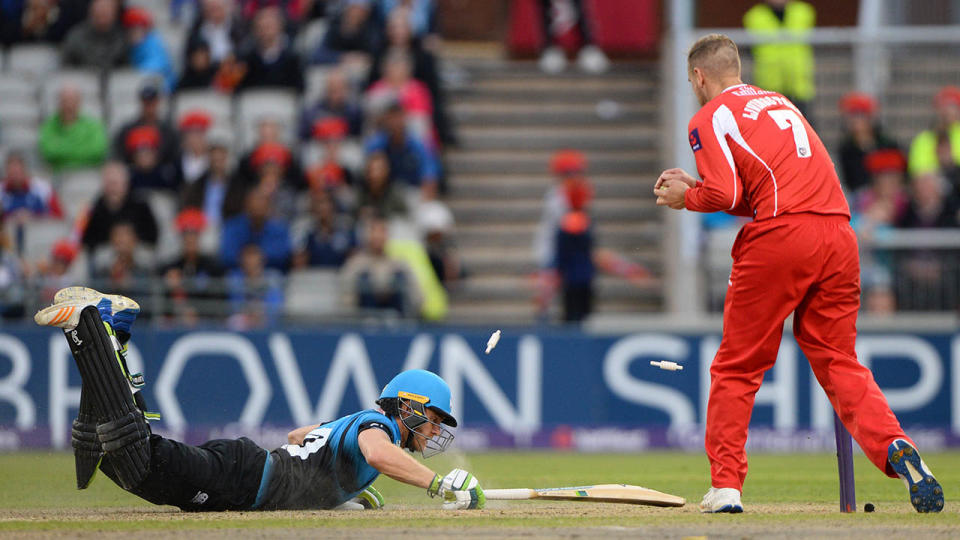 Alex Hepburn of Worcestershire Rapids dives into his crease during a NatWest T20 Blast match against Lancashire Lightning. (Photo by Nathan Stirk/Getty Images)