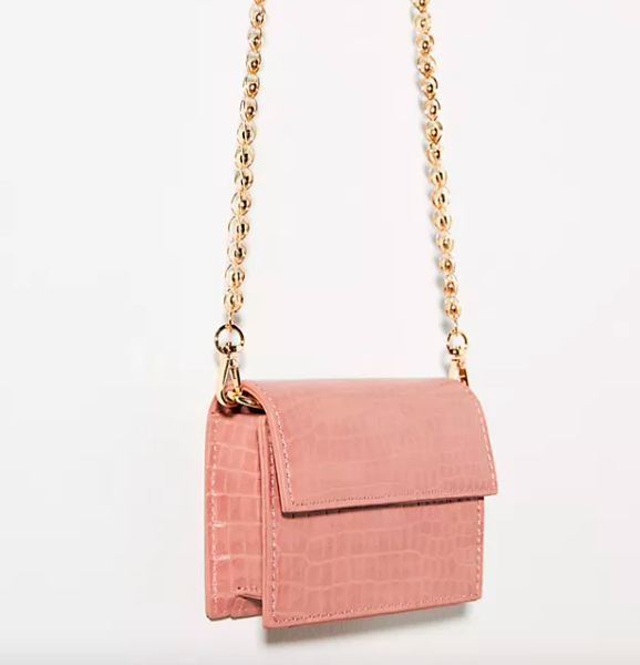 Mini Envelope Crossbody Bag in pink with gold chain strap. Image via Anthropologie.