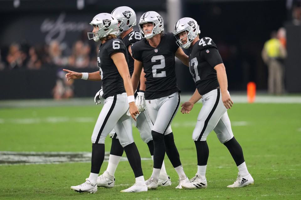 Las Vegas Raiders place kicker Daniel Carlson (2) celebrates with Las Vegas Raiders long snapper Trent Sieg (47) and Las Vegas Raiders punter AJ Cole (6) after making a field goal last year. He was a first-team All-Pro in 2022.