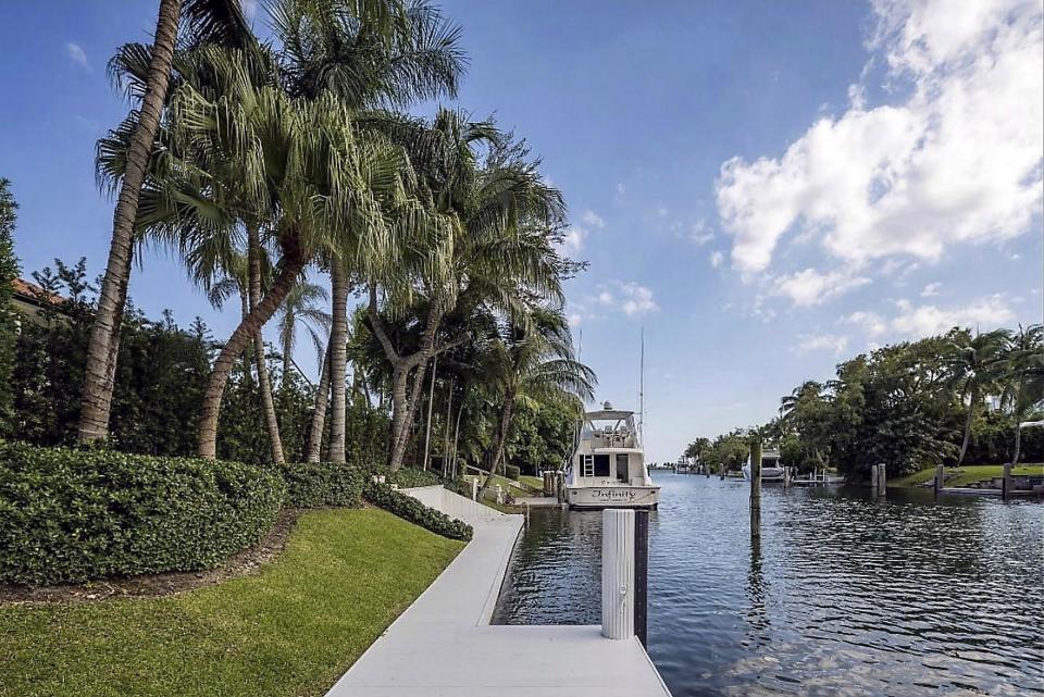 Private dock with palm trees