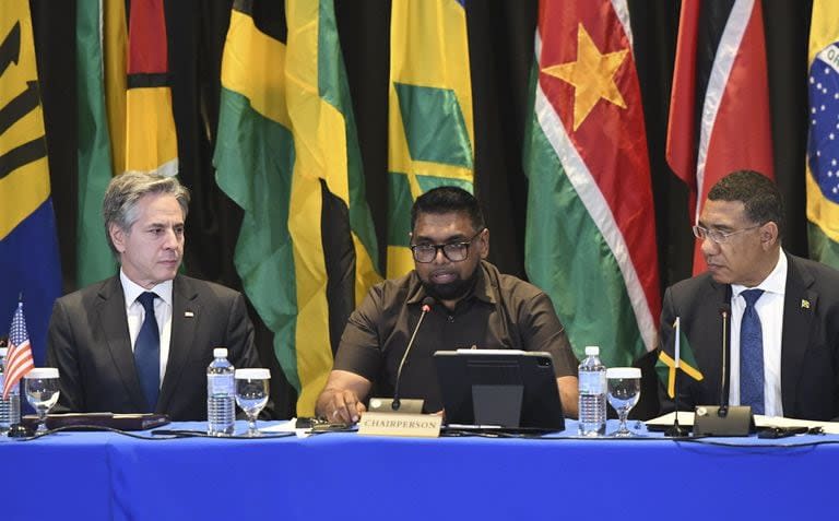 From left, U.S. Secretary of State Antony Blinken, Guyana's President Irfaan Ali and Jamaica's Prime Minister Andrew Holness attend an emergency meeting on Haiti at the Conference of Heads of Government of the Caribbean Community (CARICOM) in Kingston, Jamaica, on Monday, March 11, 2024. (AP Photo/Collin Reid)