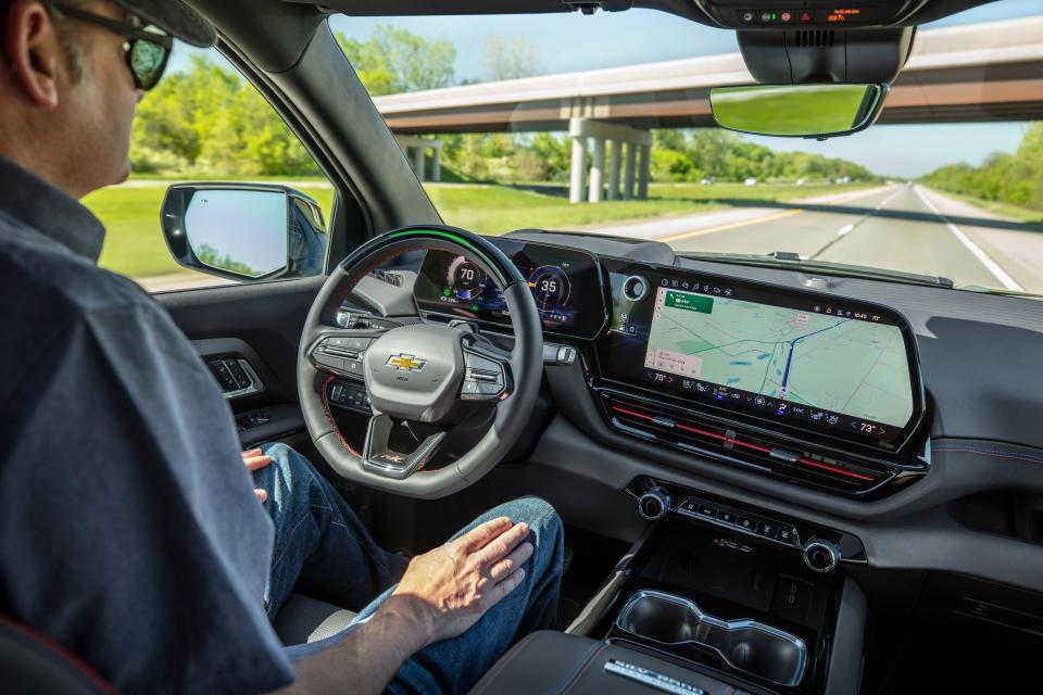 A view showing the driver using the Super Cruise hands-free system on the 2024 Silverado EV RST.