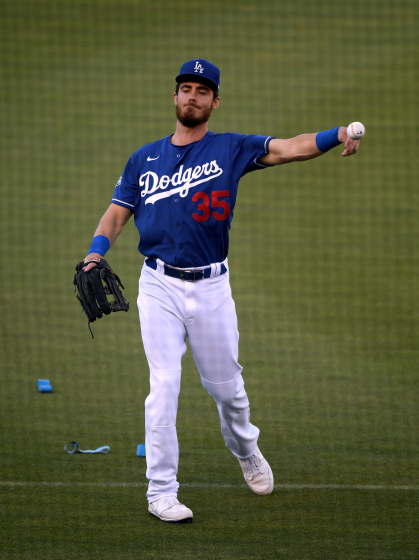 Dodgers center fielder Cody Bellinger throws during a team practice session at Dodger Stadium.