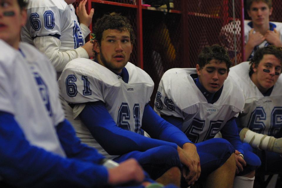 Joe Thomas (61) sits in the locker room during halftime of the 2002 WIAA Division 2 state-championship game at Camp Randall Stadium in Madison. The Lancers lost to Menomonie, 17-14.