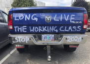 FILE - In this June 20, 2019, file photo, a diesel truck that belongs to a self-employed logger is parked in Salem, Ore. The divide in Oregon between the state’s liberal, urban population centers and its conservative and economically depressed rural areas has made it fertile ground for the political crisis unfolding over a push by Democrats to enact sweeping climate legislation. Just three years after armed militia members took over a national wildlife refuge in southeastern Oregon, some of the same groups are now seizing on a walkout by Oregon’s GOP senators to broadcast their anti-establishment message. (AP Photo/Gillian Flaccus, File)