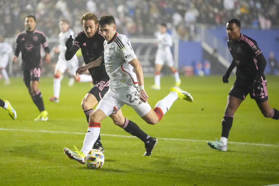 FC Dallas forward Logan Farrington (23) attacks against Inter Miami defender Ryan Sailor during the second half of a preseason friendly MLS soccer match, Monday, Jan. 22, 2024, at the Cotton Bowl in Dallas. FC Dallas won 1-0. (AP Photo/Julio Cortez)