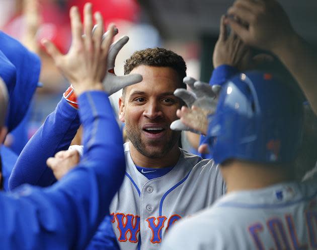 James Loney is congratulated after hitting a two-run home run in the Mets wild card-clinching win against the Phillies. (Getty Images)