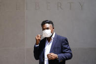 FILE - Former NFL player Ken Jenkins exits the building after delivering tens of thousands of petitions demanding equal treatment for everyone involved in the settlement of concussion claims against the NFL, to the federal courthouse in Philadelphia, on May 14, 2021. Hundreds of Black NFL retirees denied payouts in the $1 billion concussion settlement now qualify for awards after their tests were rescored to eliminate racial bias, according to a report released Friday, Aug, 12, 2022. (AP Photo/Matt Rourke, File)