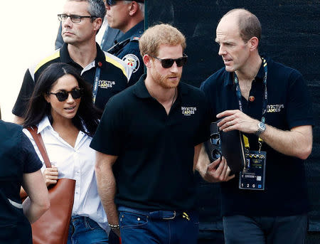 Prince Harry arrives with Meghan Markle. REUTERS/Mark Blinch