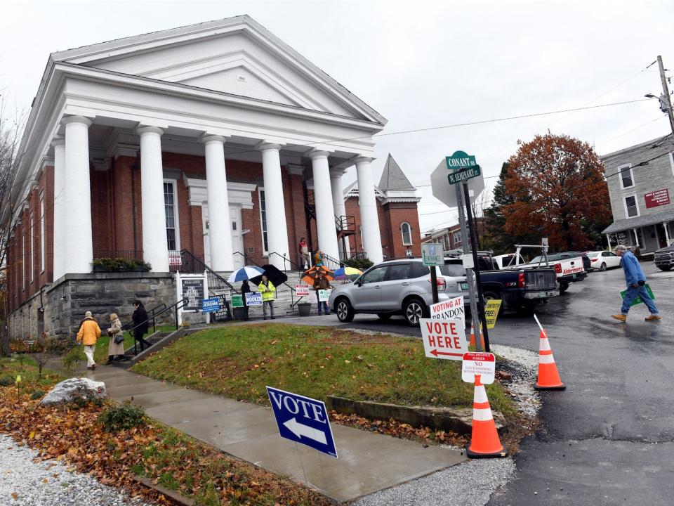 People arrive to vote in the midterm elections in Brandon, Vermont.