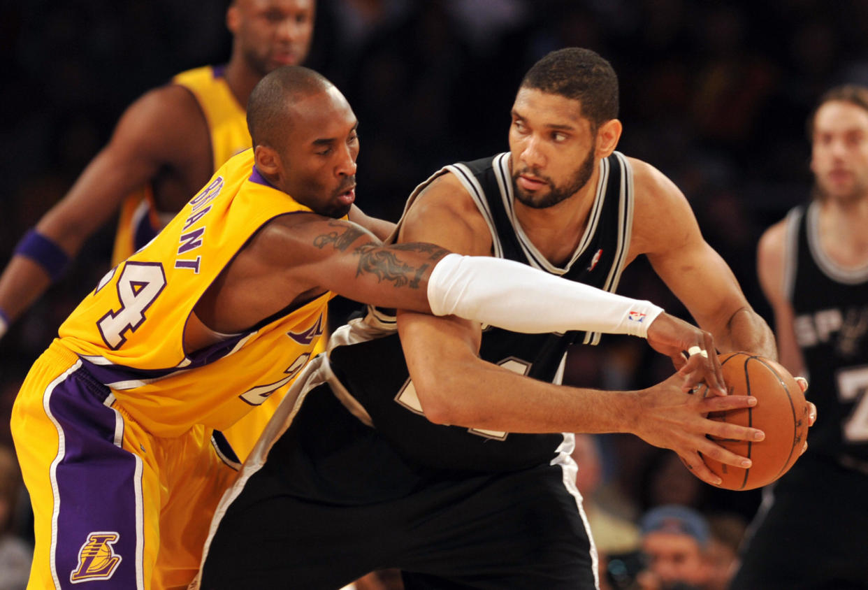 Kobe Bryant guards Tim Duncan.