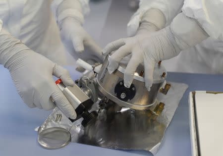 Scientists work in the International Atomic Energy Agency (IAEA) environmental sample laboratory in Seibersdorf, Austria June 13, 2018. Picture taken June 13, 2018. REUTERS/Leonhard Foeger