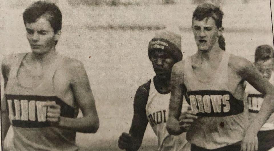 Watertown runner Darin Bach (left), shown competing along with teammate Tim Sherrill in a home cross country meet, placed 18th in the 1992 state Class AA cross country meet for the Arrows.