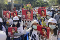 Protesters hold portraits of deposed Myanmar leader Aung San Suu Kyi during an anti-coup demonstration in Mandalay, Myanmar, Friday, March 5, 2021. Footage of a brutal crackdown on protests against a coup in Myanmar has unleashed outrage and calls for a stronger international response. (AP Photo)