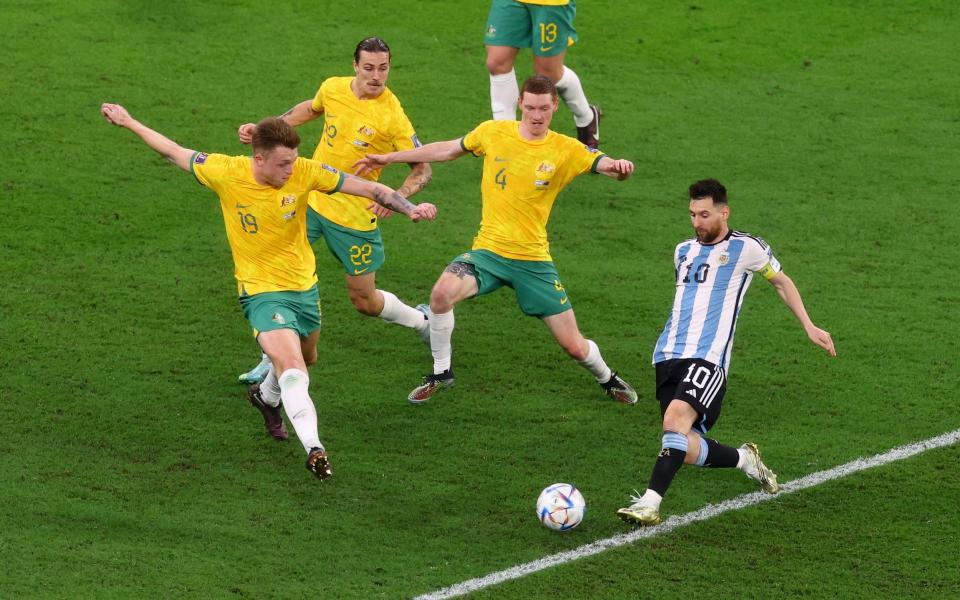 Argentina's Lionel Messi in action with Australia's Harry Souttar, Kye Rowles and Jackson Irvine - Reuters