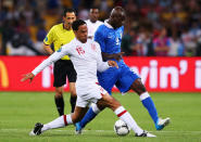 KIEV, UKRAINE - JUNE 24: Joleon Lescott of England challenges Mario Balotelli of Italy during the UEFA EURO 2012 quarter final match between England and Italy at The Olympic Stadium on June 24, 2012 in Kiev, Ukraine. (Photo by Alex Livesey/Getty Images)