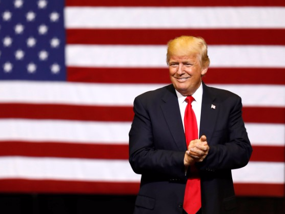 U.S. President Donald Trump takes the stage for a rally at the U.S. Cellular Center in Cedar Rapids, Iowa, U.S. June 21, 2017. REUTERS/Scott Morgan