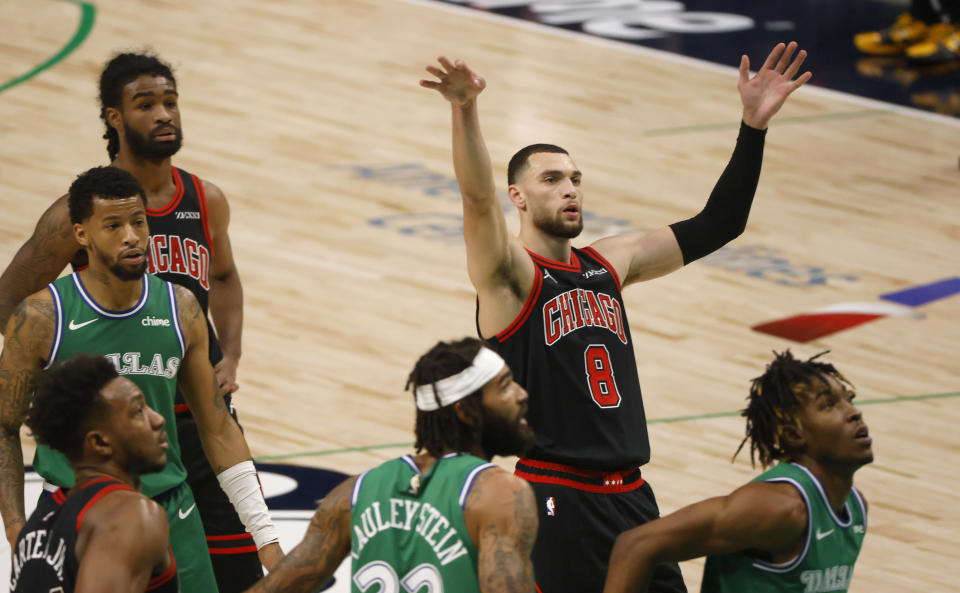 Chicago Bulls guard Zach LaVine (8) reacts after scoring on a free throw against the Dallas Mavericks during the first half of an NBA basketball game, Sunday, Jan. 17, 2021, in Dallas. (AP Photo/Ron Jenkins)