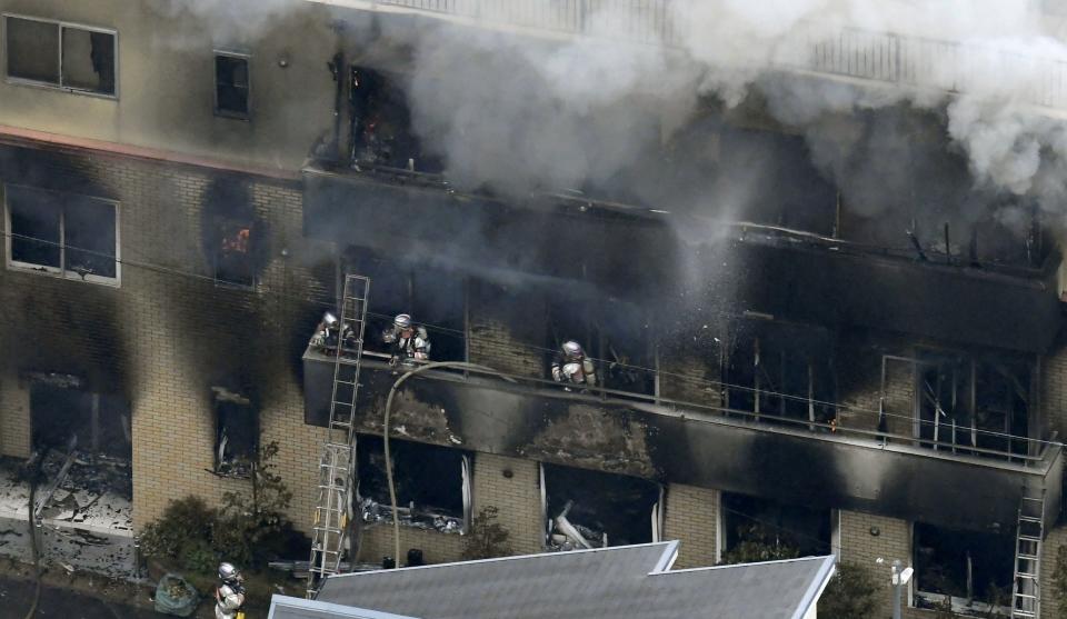 Firefighters tackle the blaze at the three-story studio (REUTERS)