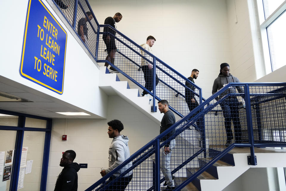 Philadelphia Police Academy applicants who passed a reading exam move onto the physical fitness exam in Philadelphia, Saturday, Feb. 24, 2024. The city has moved to lower requirements for the entry physical exam at its police academy as part of a broader effort nationally to reevaluate policies that keep law enforcement applicants out of the job pool amid a hiring crisis. (AP Photo/Matt Rourke)