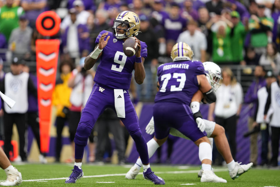 Washington quarterback Michael Penix Jr. looks to throw against Oregon during the second half of an NCAA college football game, Saturday, Oct. 14, 2023, in Seattle. Washington won 36-33. (AP Photo/Lindsey Wasson)