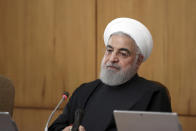 In this photo released by the official website of the Office of the Iranian Presidency, President Hassan Rouhani speaks in a cabinet meeting in Tehran, Iran, Wednesday, Jan. 15, 2020. Iran's president is warning that European soldiers deployed in the Mideast "may be in danger" after Britain, France and Germany challenged Tehran over breaking limits of its 2015 nuclear deal. (Office of the Iranian Presidency via AP)