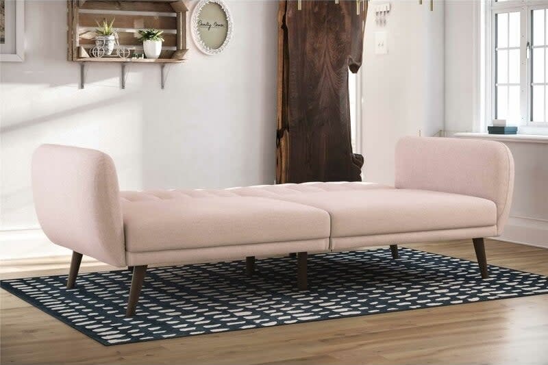 the pink couch extended into a twin bed