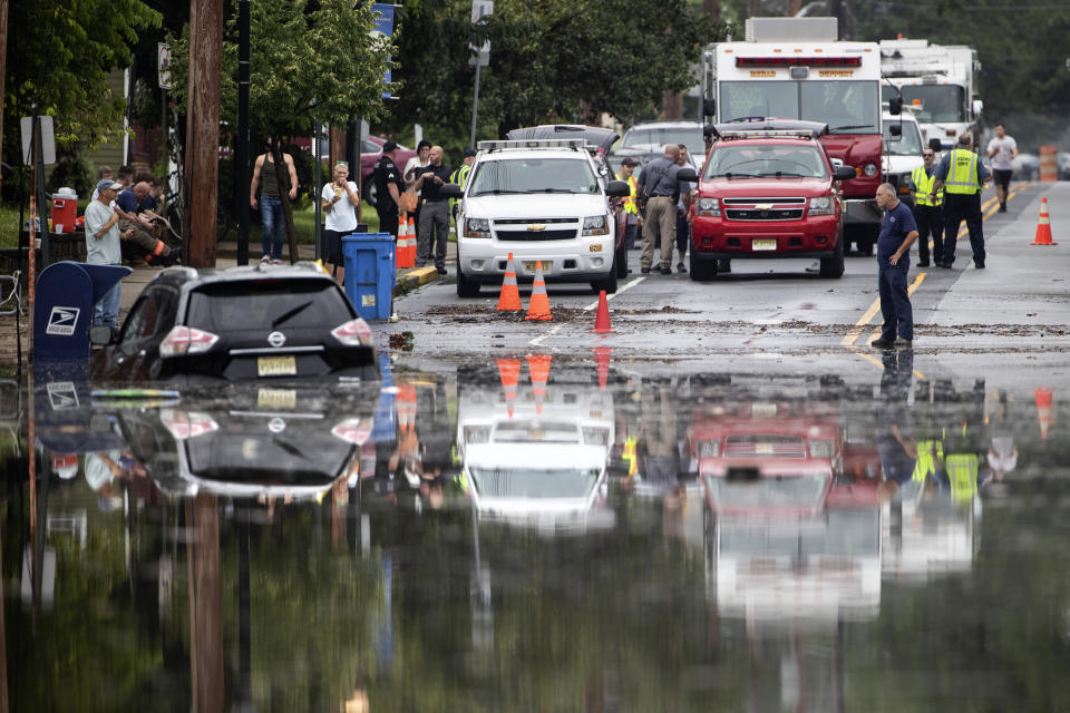 Officials and residents gather on the edge of the floodwaters submerging Broadway in Westville, N.J. Thursday, June 20, 2019. Severe storms containing heavy rains and strong winds spurred flooding across southern New Jersey, disrupting travel and damaging some property. (Photo: Matt Rourke/AP)