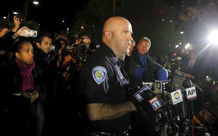 San Bernardino Police Chief Jarrod Burguan (C) speaks at a news conferenece, informing the media, that the couple Syed Rizwan Farook, 28, and Tashfeen Malik, 27, were responsible for the shooting rampage at the Inland Regional Center, in San Bernardino, California December 2, 2015. REUTERS/Alex Gallardo