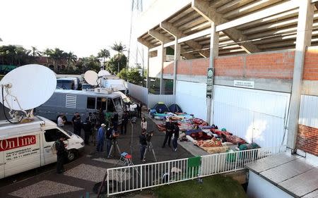 TV crew stand in front of the Arena Conda stadium in Chapeco, Brazil, December 2, 2016. REUTERS/Paulo Whitaker