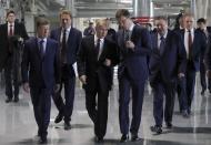 Russian President Vladimir Putin, center, visits a new power plant in Crimea, part of Moscow's efforts to upgrade the region's infrastructure in Sevastopol, Crimea, Monday, March 18, 2019. Putin visited Crimea to mark the fifth anniversary of Russia's annexation of Crimea from Ukraine by visiting the Black Sea peninsula. (Mikhail Klimentyev, Sputnik, Kremlin Pool Photo via AP)