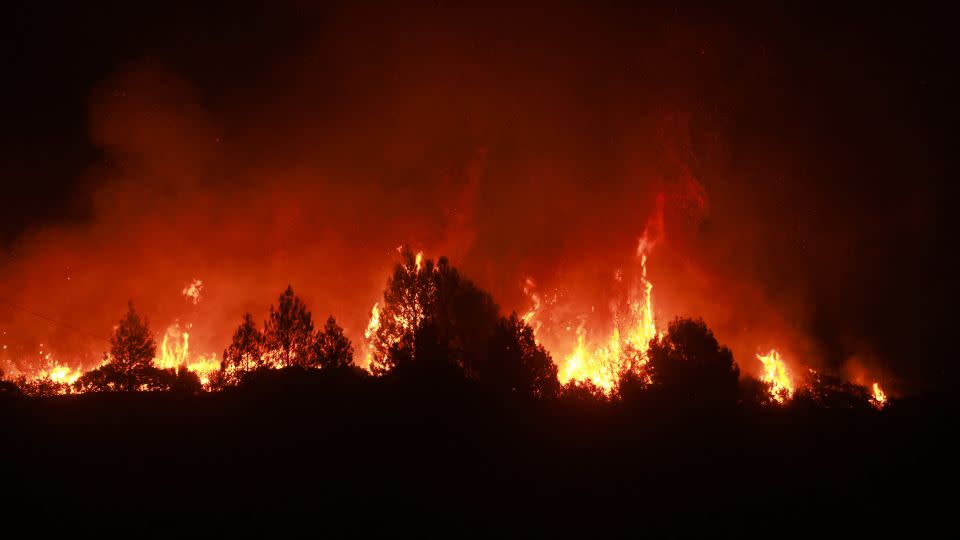 The Line Fire burns next to highway 330 near Running Springs, California, on September 7, 2024. - David Swanson/AFP/Getty Images