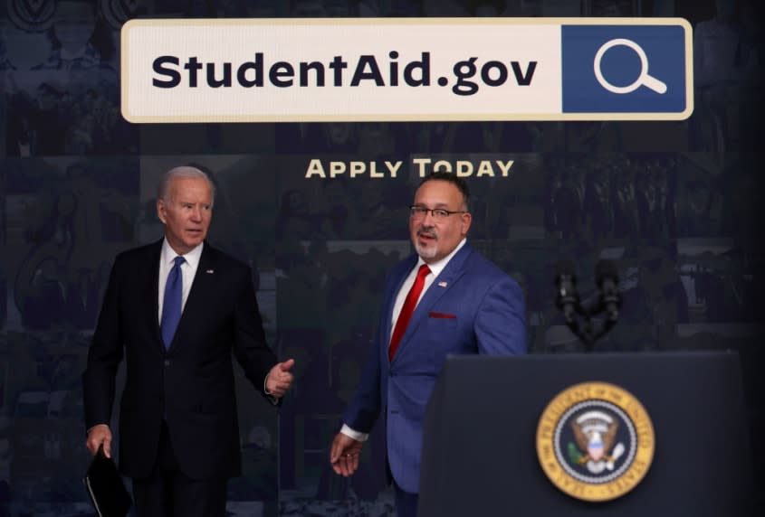 biden and Miguel Cardona  photo