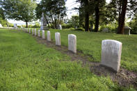 Headstones of children who at died in the late 1800s and early 1900s at the Home for Destitute Children, in Burlington, Vt., are shown, Wednesday, Sept. 21, 2022. Volunteers recently restored the gravestones, resetting, straightening and cleaning them. (AP Photo/Lisa Rathke)