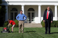 <p>11-year-old Frank “FX” Giaccio (L), with U.S. President Donald Trump (R), starts his lawnmower while mowing the grass in the Rose Garden of the White House September 15, 2017 in Washington, DC. Giaccio, from Falls Church, Virginia, who runs a business called FX Mowing, wrote a letter to Trump expressing admiration for Trump’s business background and offered to mow the White House grass. Also pictured is Frank’s father, Greg Giaccio (L). (Photo: Win McNamee/Getty Images) </p>