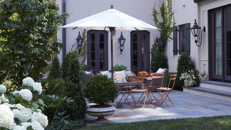 porch with orange patio furniture