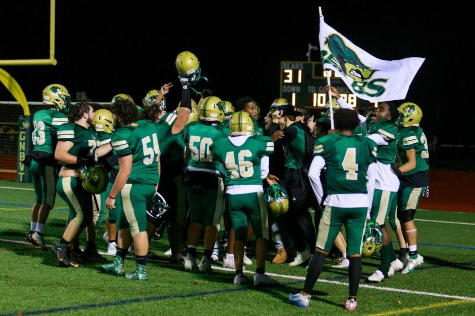 GNB Voc-Tech celebrates following a win in the State Vocational Large semifinal against Assabet.