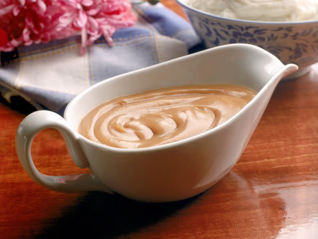 <p>If you burn gravy and don't have enough time—or pan drippings—to start from scratch, stir in a teaspoon of smooth peanut butter for each cup of gravy. This should eliminate any burned taste.</p>