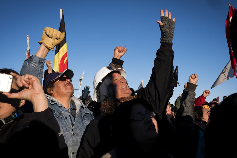 Dakota Access Pipeline protesters celebrate after learning that the Army Corps of Engineers denied the drilling permit to drill under Lake Oahe near Cannon Ball, North Dakota.