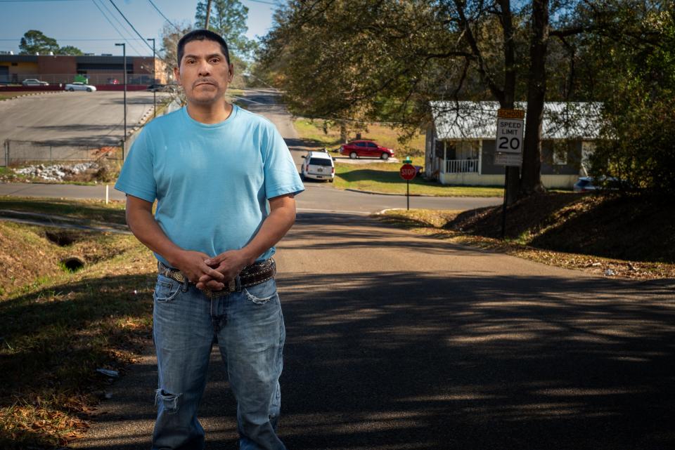 Gabino Ramos Hernandez stands on a country road in Mississippi