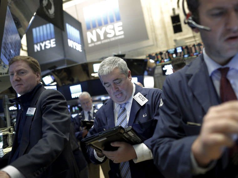 Traders work at the Barclay's post on the floor of the New York Stock Exchange January 26, 2016. REUTERS/Brendan McDermid