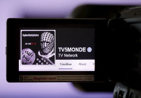 A print screen of the hacked Facebook page of French television network TV5Monde is seen on a camera viewer in Paris, April 9, 2015. REUTERS/Christian Hartmann