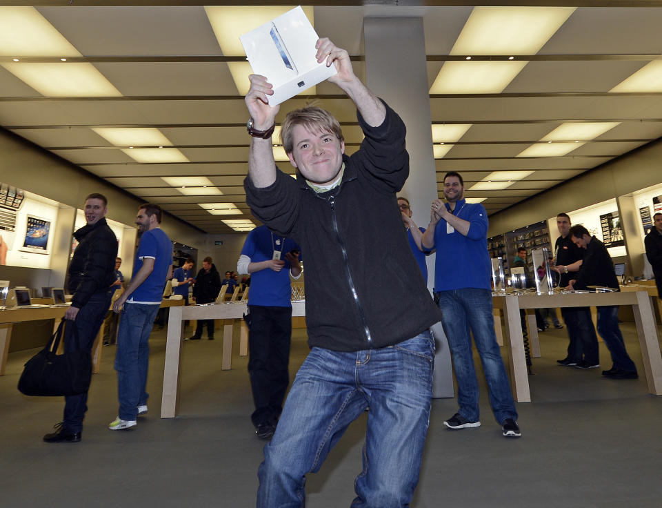 Lukas from Germany is the first to get the new iPad at the Apple store in a shopping mall in Oberhausen, western Germany, Friday, March 16, 2012. Apart from a few countries, there is an internationally coordinated simultaneous release of the iPad. (AP Photo/Martin Meissner)
