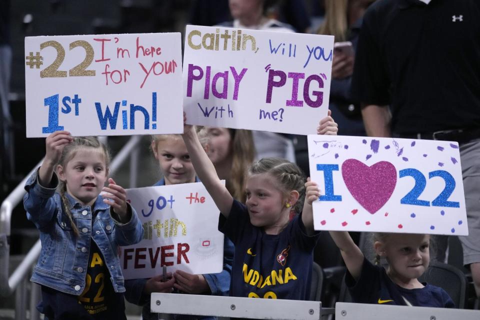Fans watch Indiana Fever guard Caitlin Clark warm up for the team's game against the New York Liberty on Thursday.